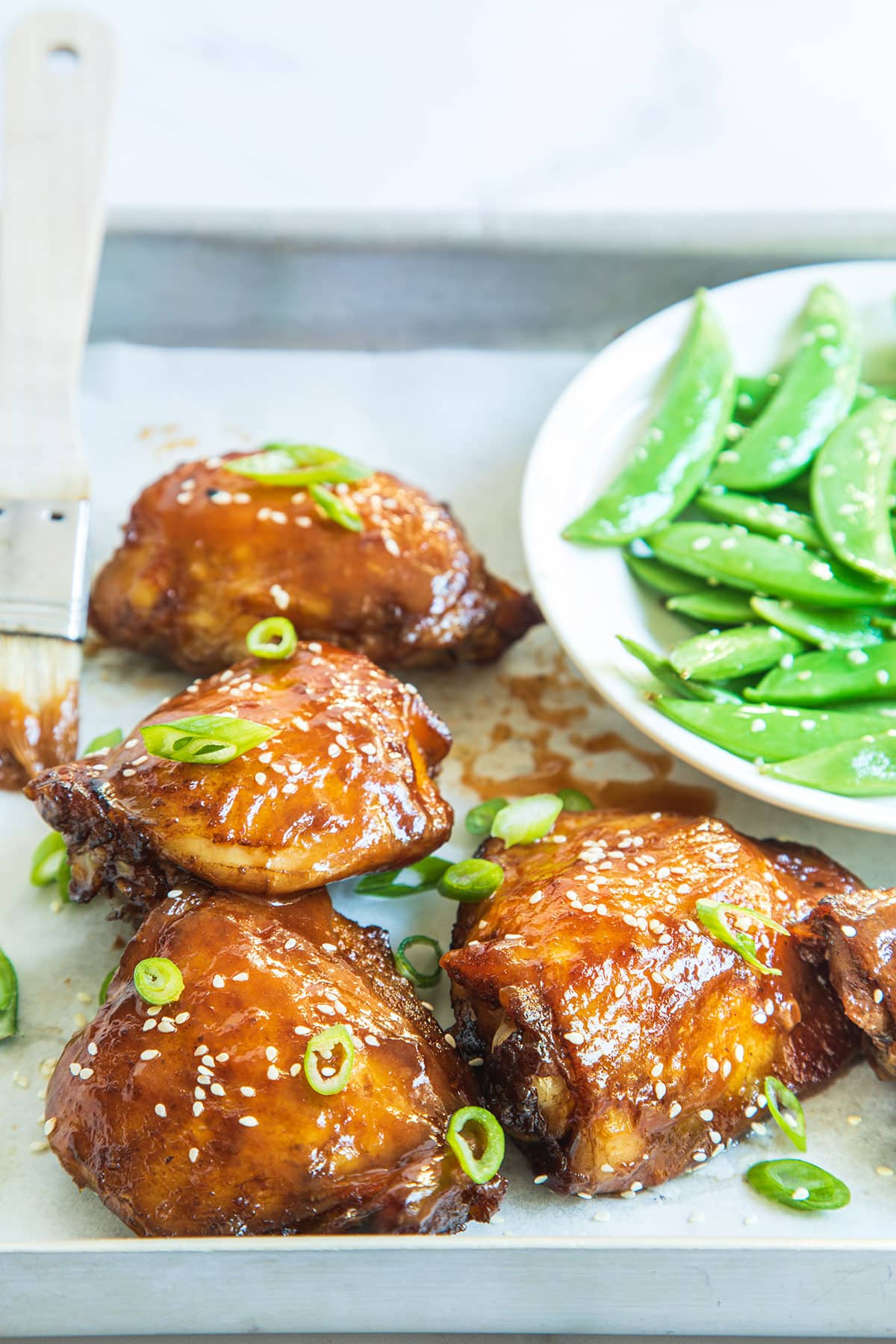 Healthy homemade Asian baked honey soy chicken in a serving dish.