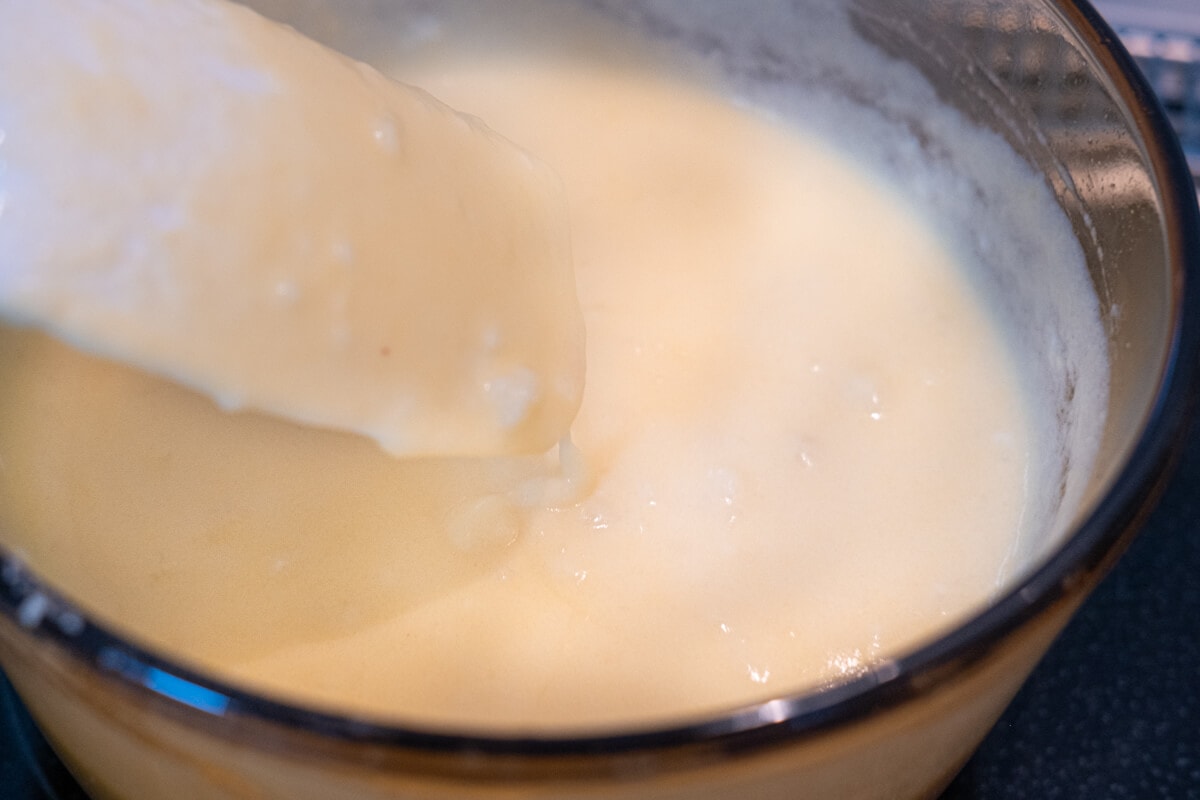 Cook a creamy soup base in a saucepan. 