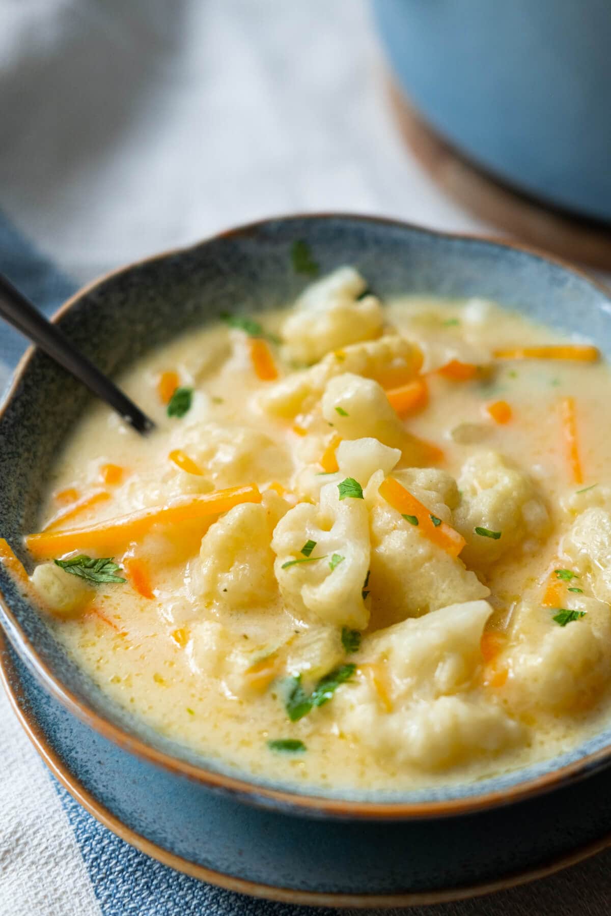 Creamy cauliflower soup is overloaded with tender cauliflower, carrots in a cheesy soup base.