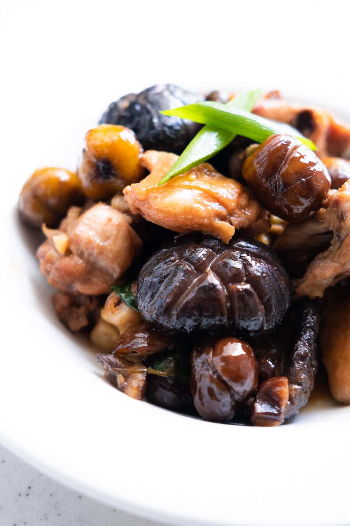 Chestnut chicken with juicy mushrooms and scallion on top. 