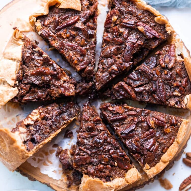 Chocolate pecan pie with crunchy pecans on the side.