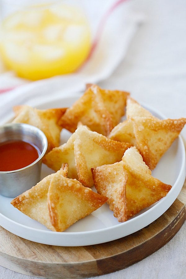 Crab Rangoon on a white plate, ready to serve.