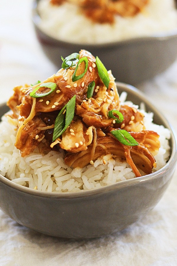 Slow Cooker Honey Teriyaki Chicken on top of rice in a bowl.