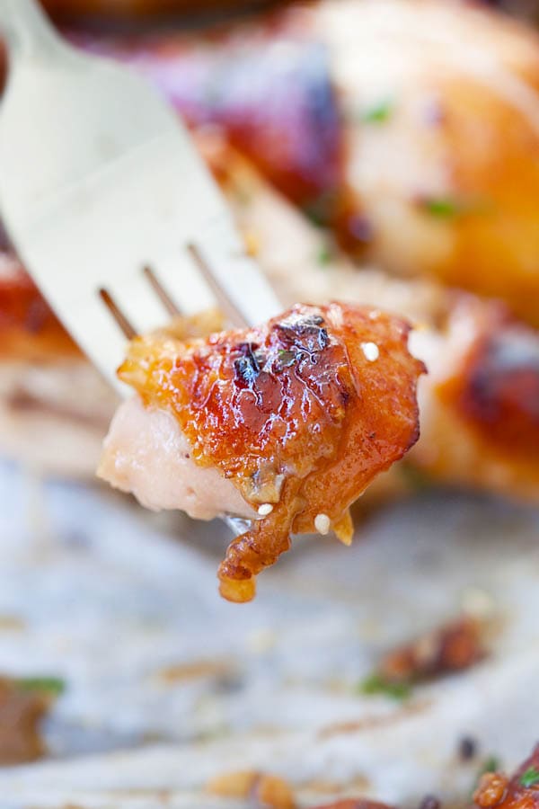 Healthy baked brown chicken poked with a fork.
