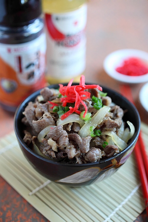 Gyudon Japanese Beef Bowl in serving dish topped with scallions and beni shoga.