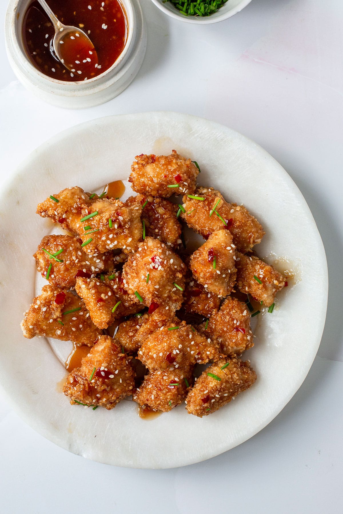 Easy and delicious chicken bites with a side of honey garlic sauce in a plate.