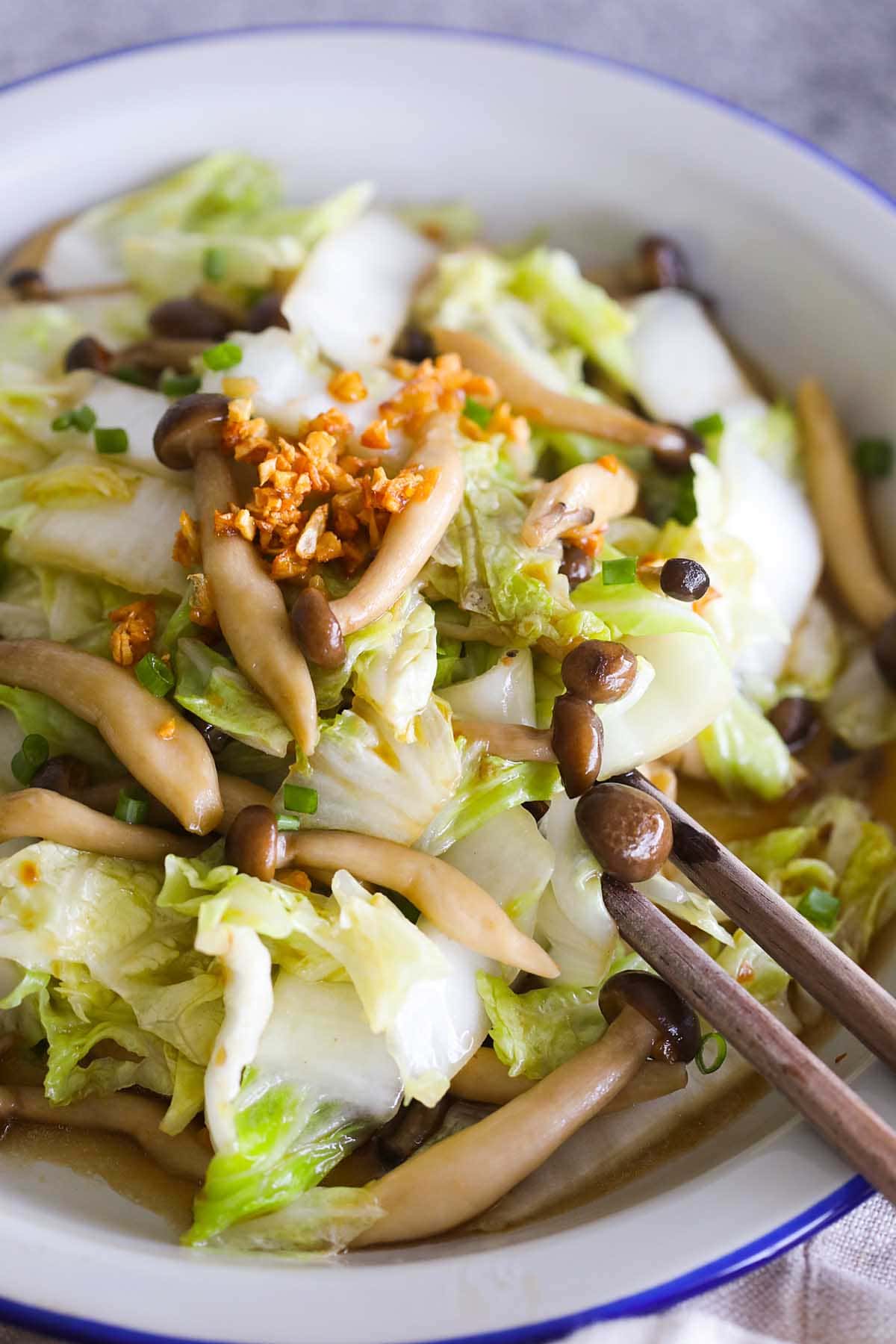 Napa cabbage stir fry with mushroom on a plate.