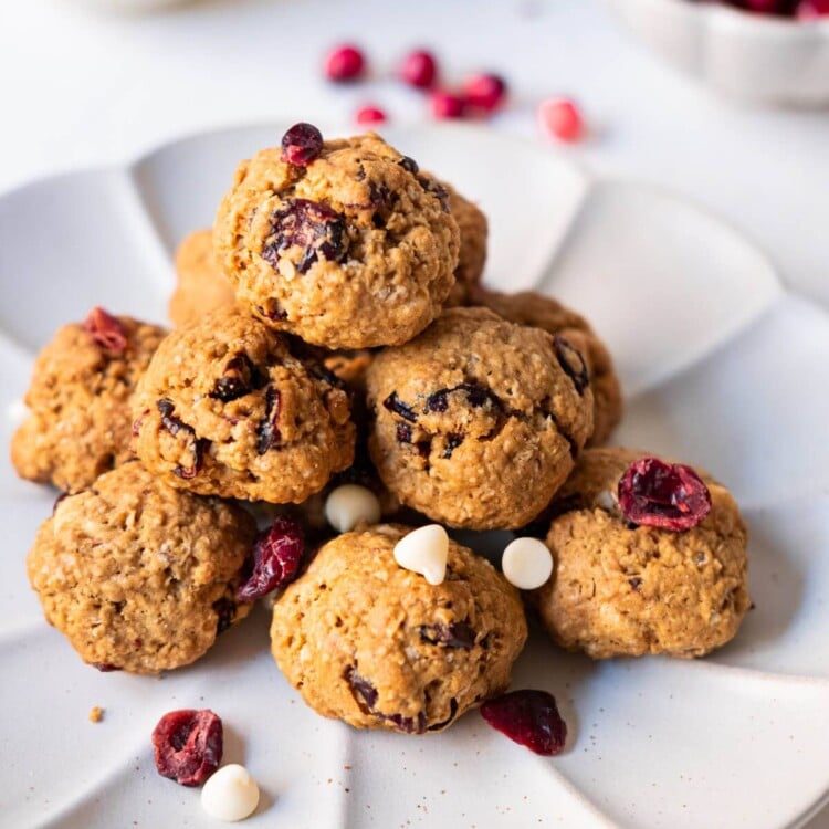 Oatmeal chocolate cranberry cookies with white chocolate chips and dried cranberries on a plate.