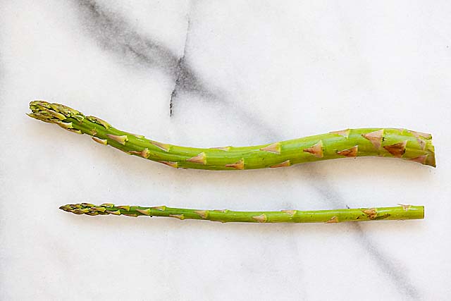 Asparagus with skinny and thick stems or stalks.
